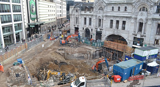 A building site surrounded by classical and modern architecture
